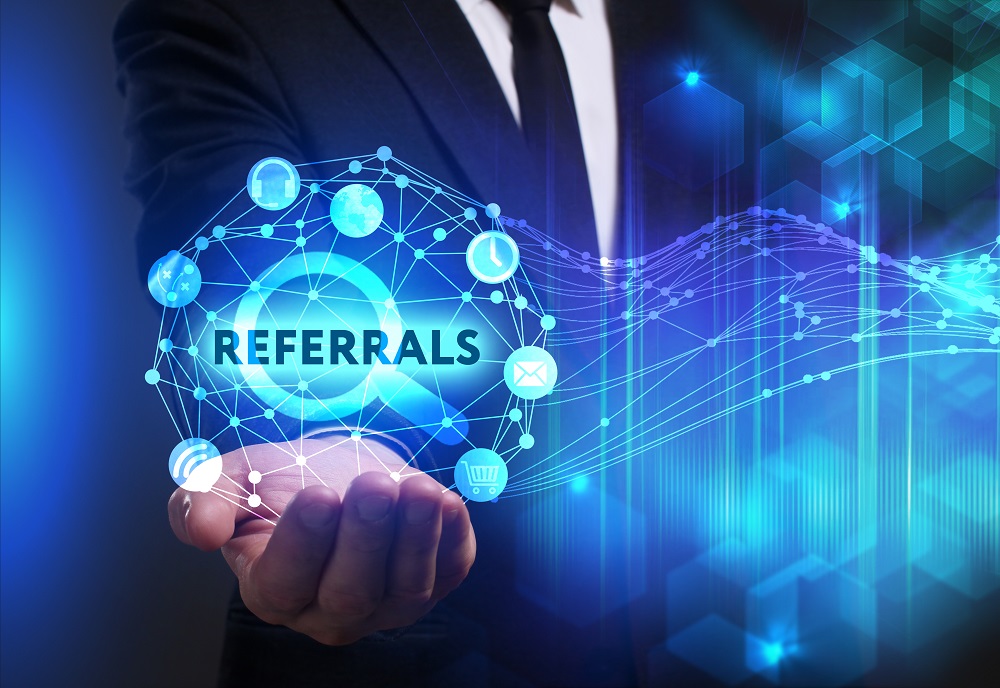 Referrals symbol showing in palm of hand